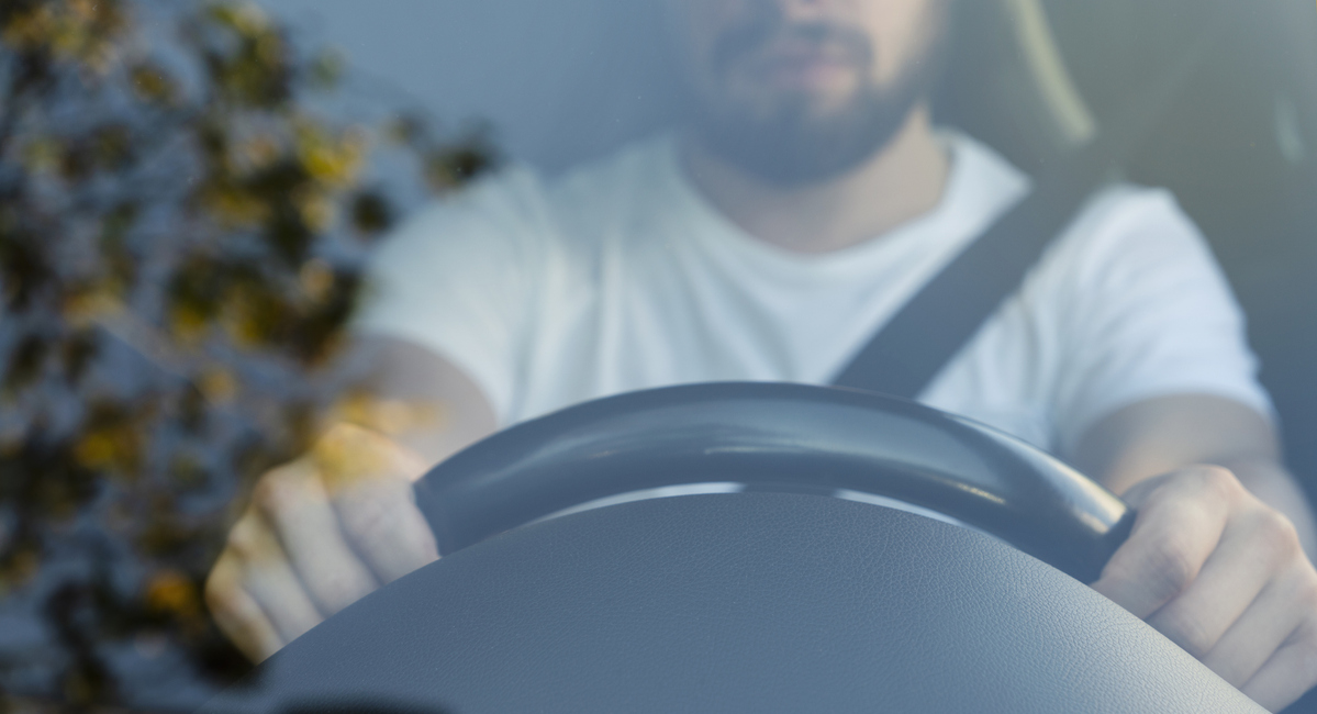 man driving a car